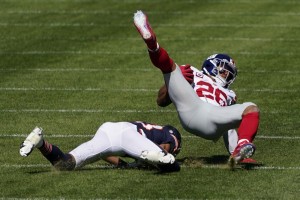 New York Giants running back Saquon Barkley (26) is brought down by Chicago Bears cornerback Kyle Fuller (23) during the first half of an NFL football game in Chicago, Sunday, Sept. 20, 2020. Photo by Charles Rex Arbogast-Photojournalist