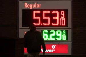 A person walks past a sign for fuel prices at a gas station on Wednesday, May 6, 2026 in Portland, Ore. (AP Photo/Jenny Kane)